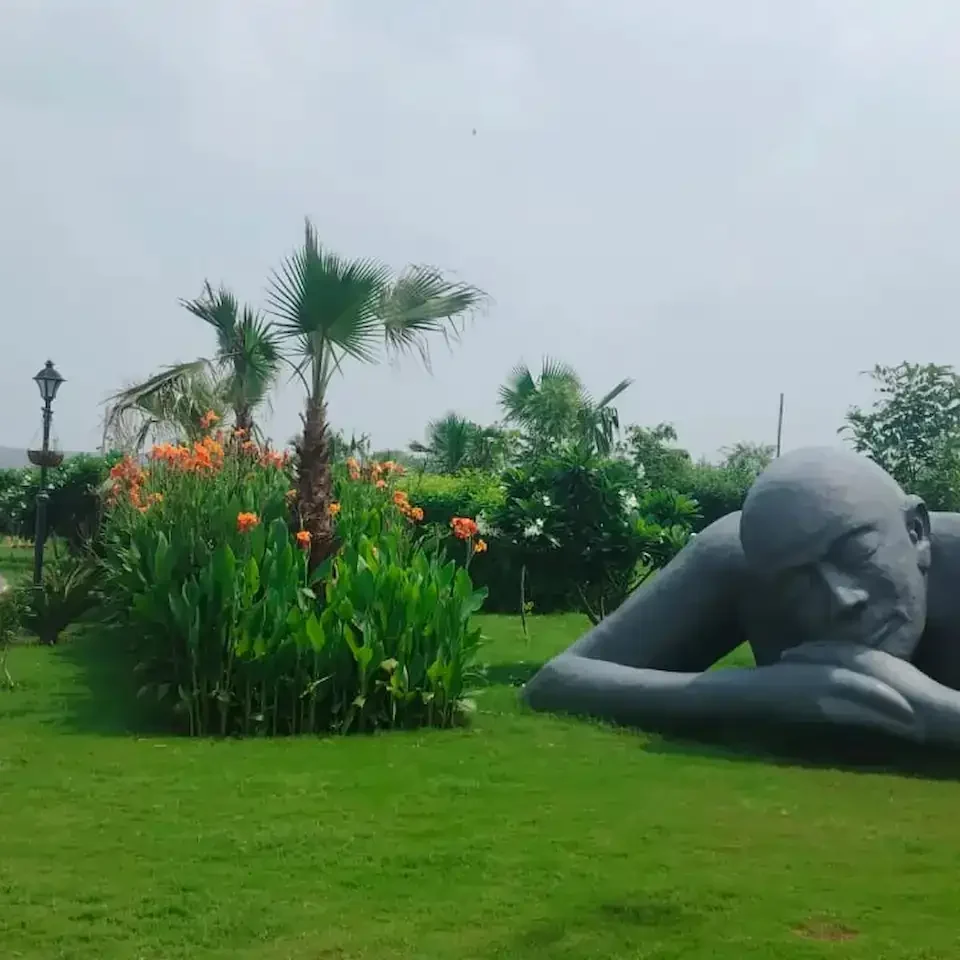 Road with statue of Human araville farms